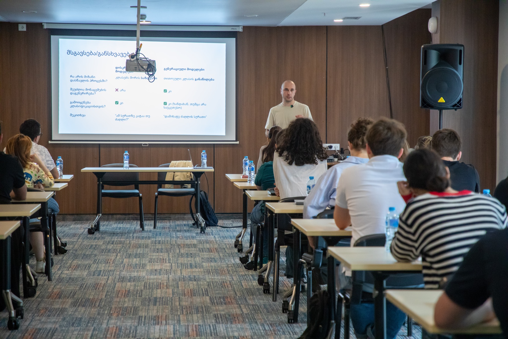 AI workshop classroom with instructor presenting to students